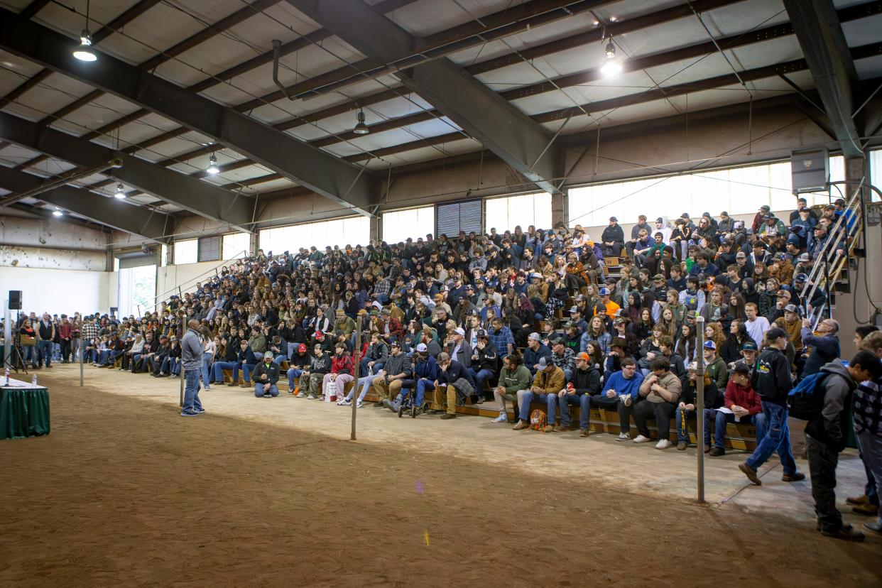Students gather in the livestock arena at the Lane County Fairgrounds for a Future Forestry Workers Career Day during the Oregon Logging Conference in Eugene.