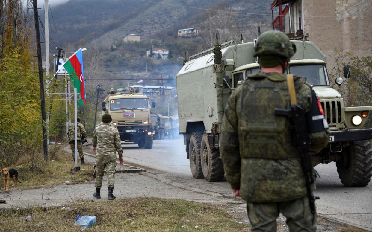 Azerbaijani soldiers and military trucks on December 1 rolled into the final district given up by Armenia  - KAREN MINASYAN/AFP via Getty Images