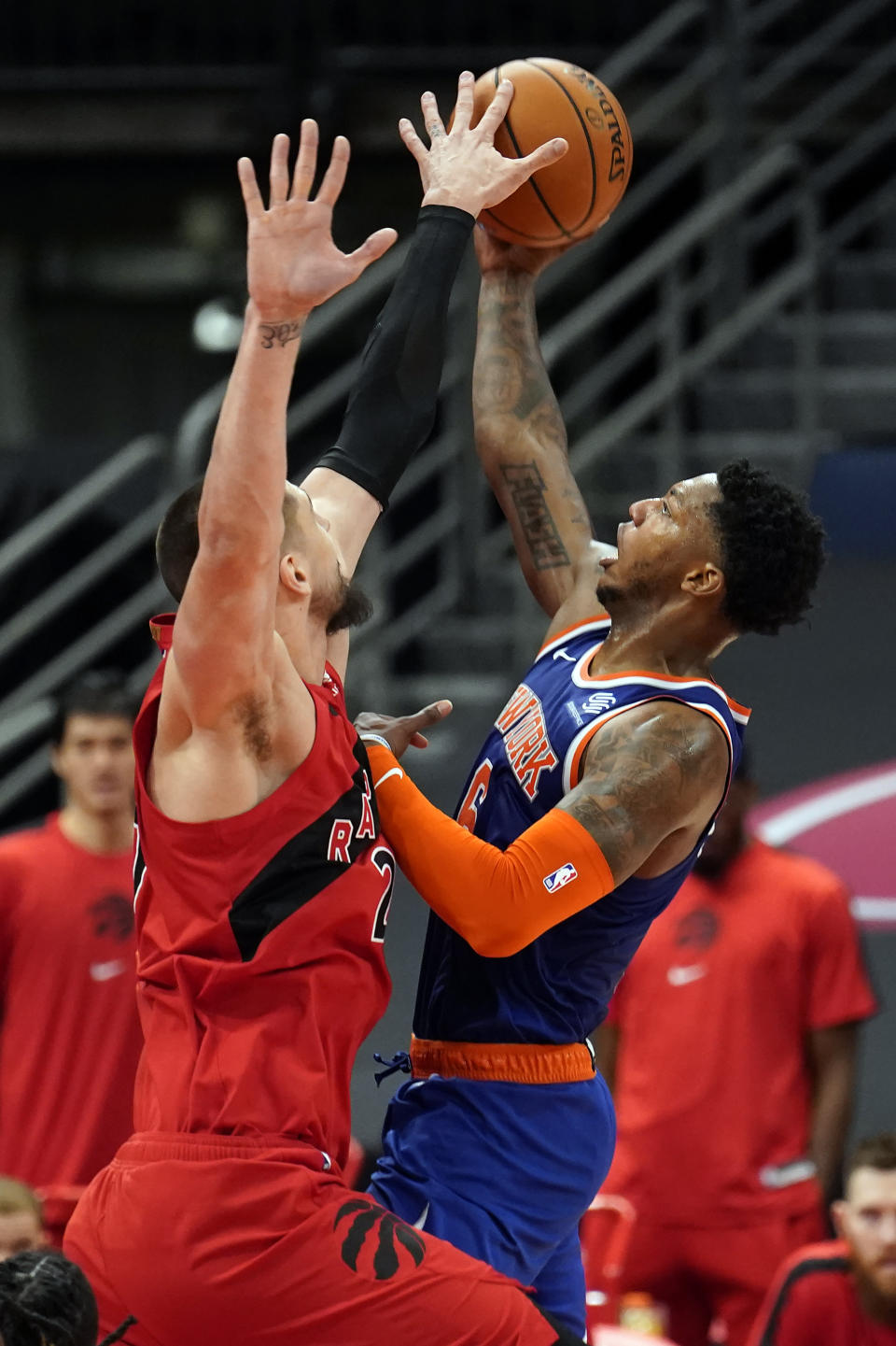 Toronto Raptors center Alex Len (27) blocks a shot by New York Knicks guard Elfrid Payton (6) during the second half of an NBA basketball game Thursday, Dec. 31, 2020, in Tampa, Fla. (AP Photo/Chris O'Meara)