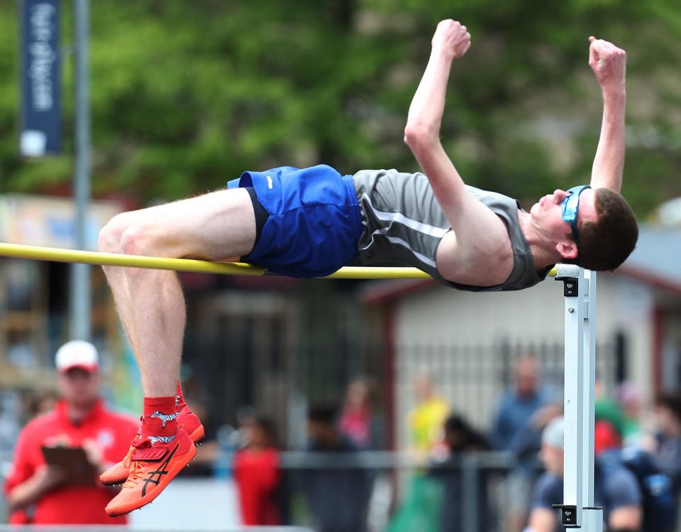 W.S. Northwestern's Jacob Wakefield attempts to clear the bar during the boys high jump at the Div. II regional track and field tournament at Austintown Fitch High School on Saturday.