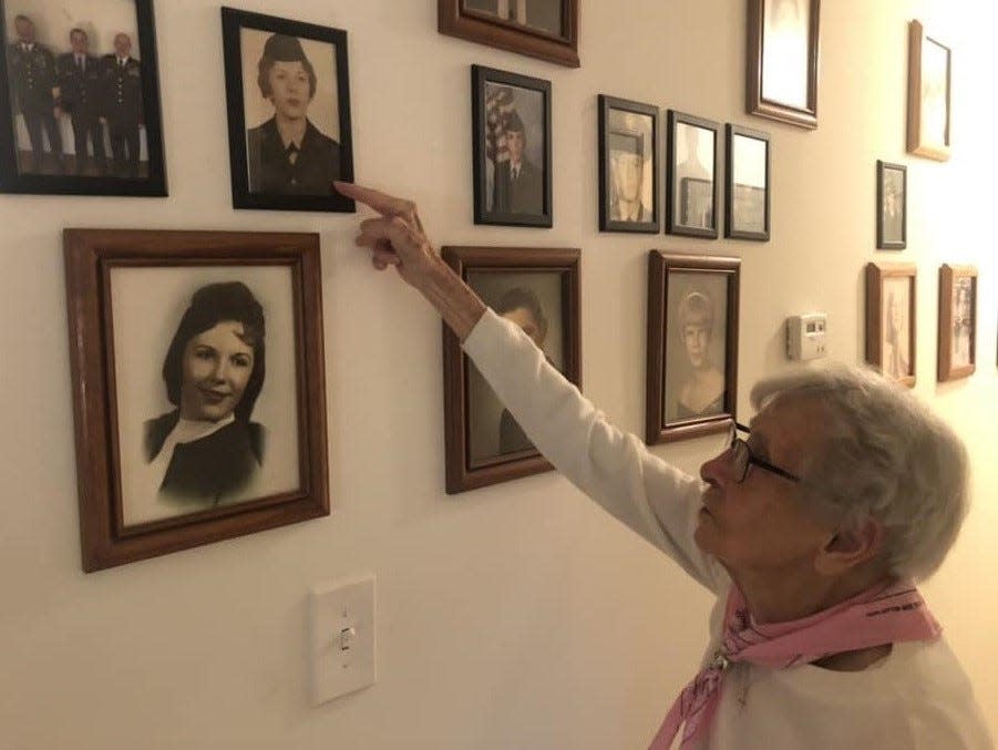 Centenarian Eva Daywalt Mowen points to a portrait of her daughter Elizabeth dressed in her Womens Army Corps uniform.