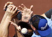 <p>Fans try to catch a foul ball hit by Kansas City Royals’ Whit Merrifield during the fifth inning of a baseball game against the Chicago White Sox, Saturday, May 28, 2016, in Kansas City, Mo. (AP Photo/Charlie Riedel) </p>