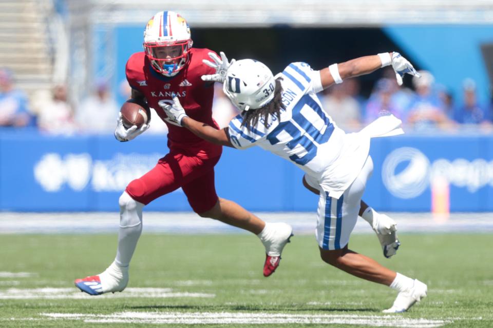 Kansas redshirt sophomore wide receiver Lawrence Arnold (2) maneuvers around Duke's defensive back Brandon Johnson (30) during the third quarter of Saturday's game at David Booth Kansas Memorial Stadium.