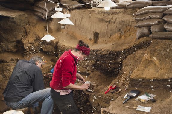 Archeologists work in Blombos Cave.