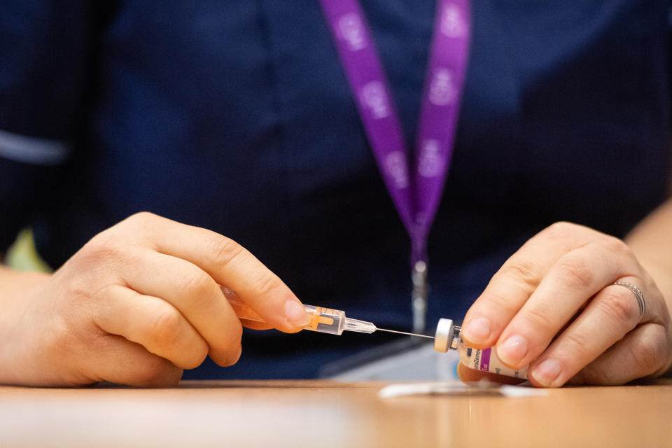 A nurse prepares a dose of the Oxford/AstraZeneca Covid-19 vaccine at the NHS vaccine centre that has been set up in the grounds of the horse racing course at Epsom in Surrey. The centre is one of the seven mass vaccination centres now opened to the general public as the UK government continues to ramp up the vaccination programme against Covid-19.