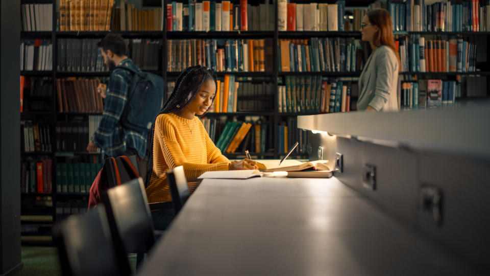 A woman studies at a university library