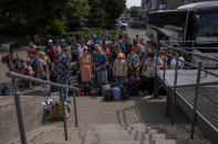 Internally displaced people wait to board a train heading to Dnipro, at the Pokrovsk train station, Donetsk region, eastern Ukraine, Friday, July 8, 2022. (AP Photo/Nariman El-Mofty)