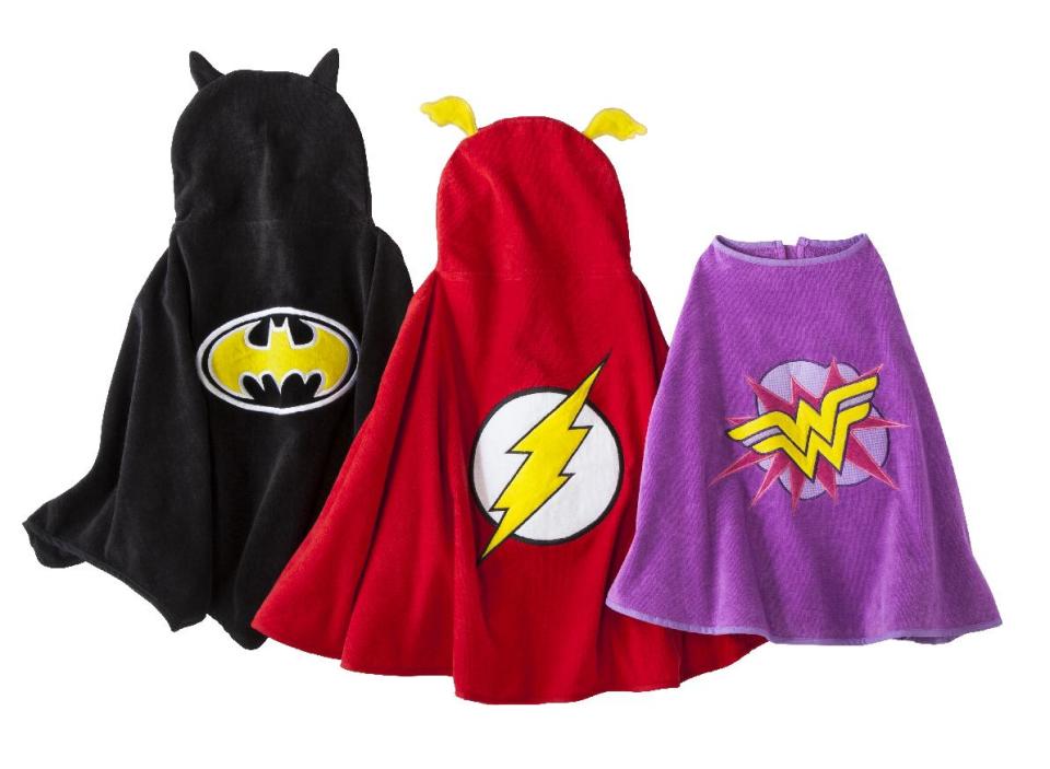 This product image released by target shows superhero-inspired beach towel capes. Along with the sunscreen, book, toys and snacks we haul to our waterside of choice this summer, we need a beach towel or two. These superhero-inspired beach towel capes are a fun way for children to dry off and play at the same time this summer. (AP Photo/Target)