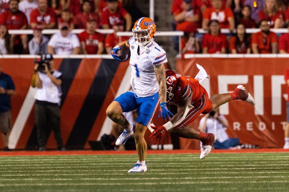 Utah Utes linebacker Levani Damuni (3) tackles Florida Gators wide receiver Ricky Pearsall (1) during the season opener at Rice-Eccles Stadium in Salt Lake City on Thursday, Aug. 31, 2023. | Megan Nielsen, Deseret News