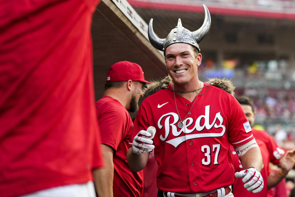 Cincinnati Reds' Tyler Stephenson celebrates with teammates in the dugout after hitting a solo home run during the fourth inning of a baseball game against the Milwaukee Brewers in Cincinnati, Monday, June 5, 2023. (AP Photo/Aaron Doster)