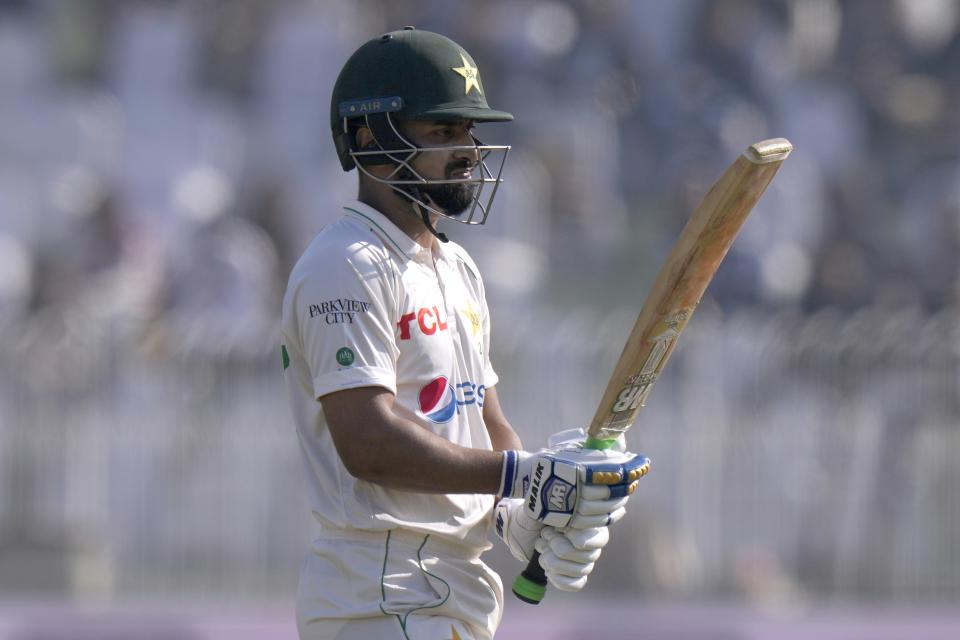 Pakistan's Abdullah Shafique reacts as he walks off the field after his dismissal during the third day of the first test cricket match between Pakistan and England, in Rawalpindi, Pakistan, Saturday, Dec. 3, 2022. (AP Photo/Anjum Naveed)