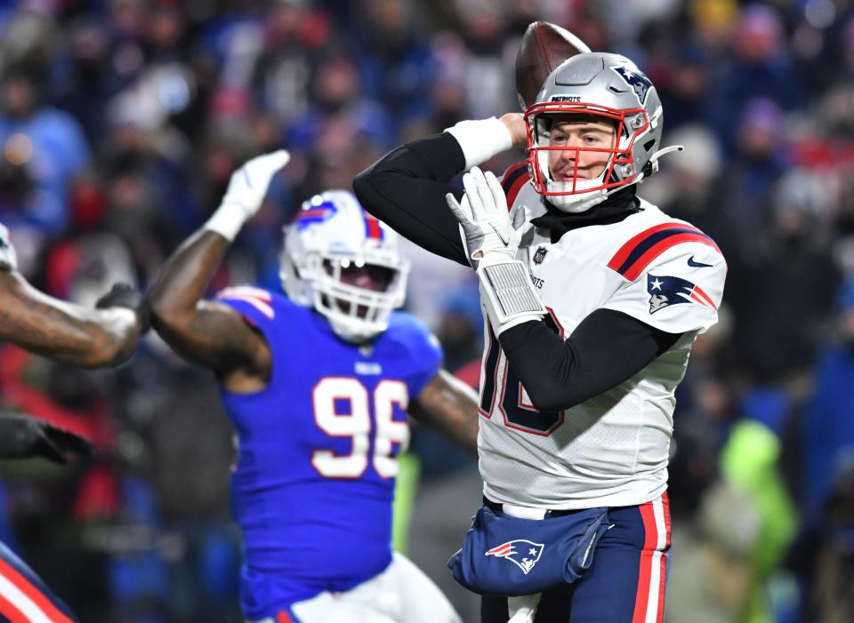 New England Patriots quarterback Mac Jones throws during the second quarter of the AFC Wild Card playoff game against the New England Patriots at Highmark Stadium in Orchard Park, New York, on Saturday, Jan 15, 2022.