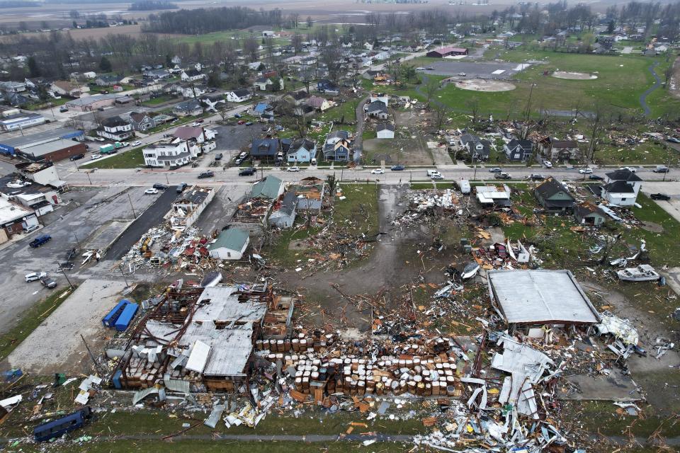 Debris scatters the ground following a severe storm Friday, March 15, 2024, in Lakeview, Ohio. (AP Photo/Joshua A. Bickel)