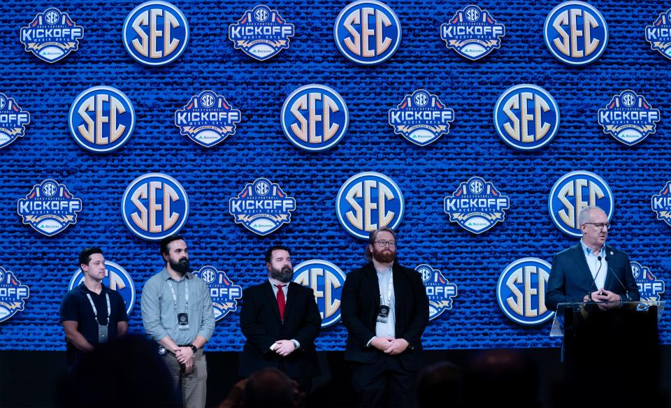 SEC Commissioner Greg Sankey, right, recognizes members of the Metro Nashville Police Department who responded to the fatal mass shooting at Covenant School during the 2023 SEC Football Kickoff Media Days at the Nashville Grand Hyatt on Broadway, Monday, July 17, 2023. They are, from left, Det. Michael Collazo, Det. Zachary Plese, Sgt. Jeff Mathes and Det. Ryan Cagle. The fifth officer involved in the incident, Officer Rex Engelbert, was not able to attend.