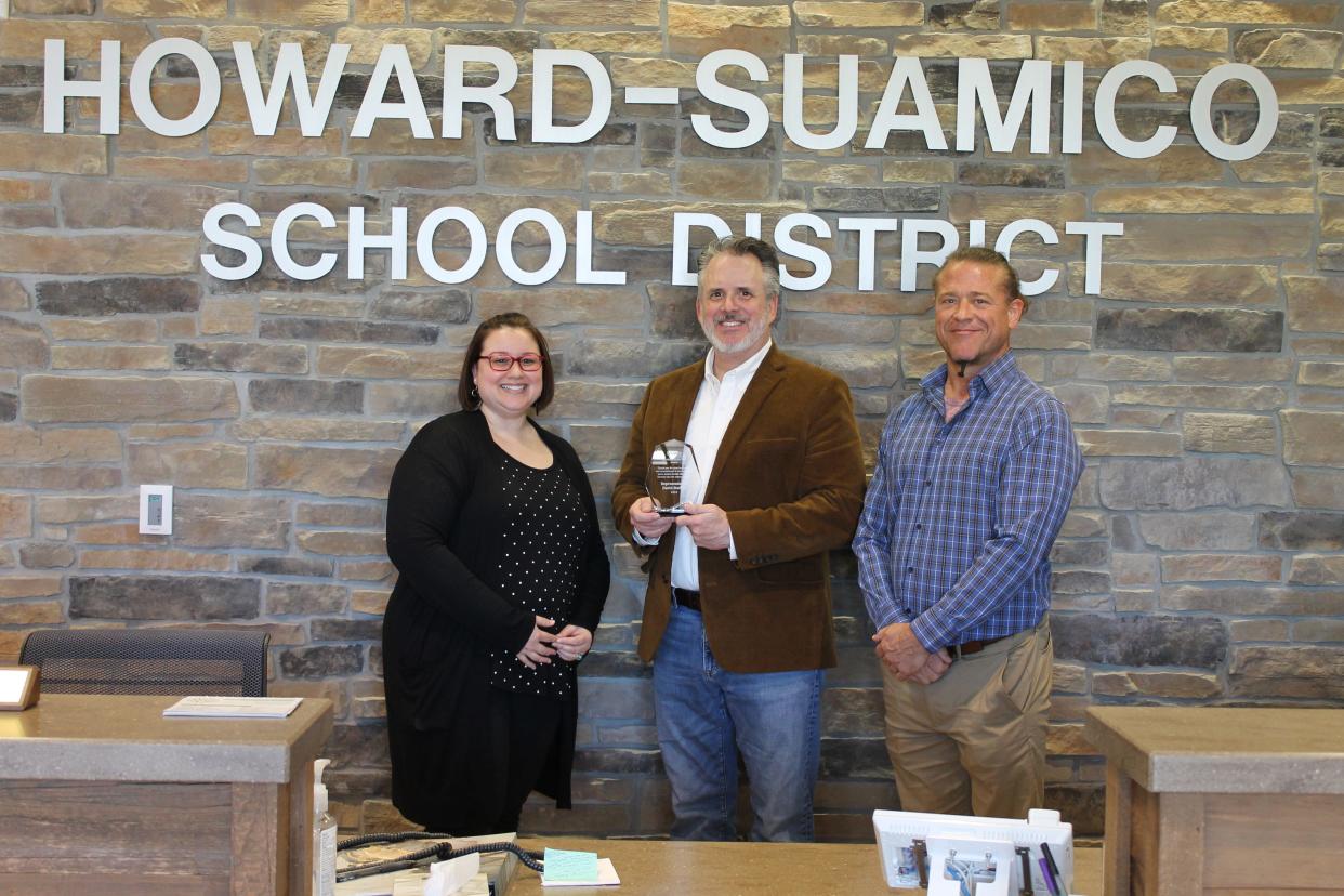 Rep. David Steffen, R-Howard, center, holds the 2024 Legislator of the Year Award from the Wisconsin Association of Marriage and Family Therapy. Amanda Anderson, chairperson of the Wisconsin Association of Marriage and Family Therapy, left, selected Steffen as a co-winner for his efforts to get the expanded marriage and family therapy bill passed.