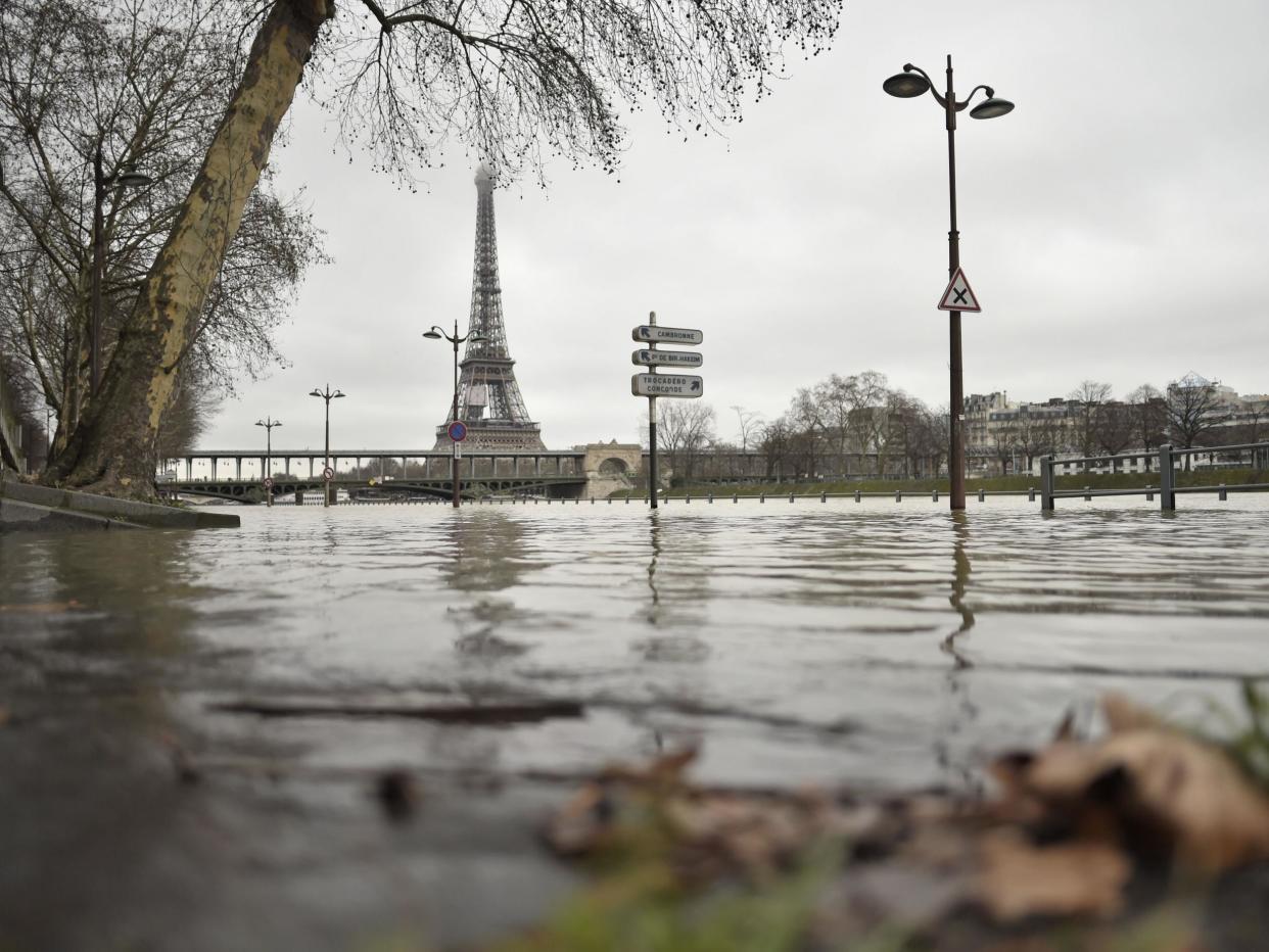 A photo taken on 23 January shows flooded banks of the river Seine, which has overflown after torrential rain has battered Paris: Stephane De Sakutin / AFP / Getty Images