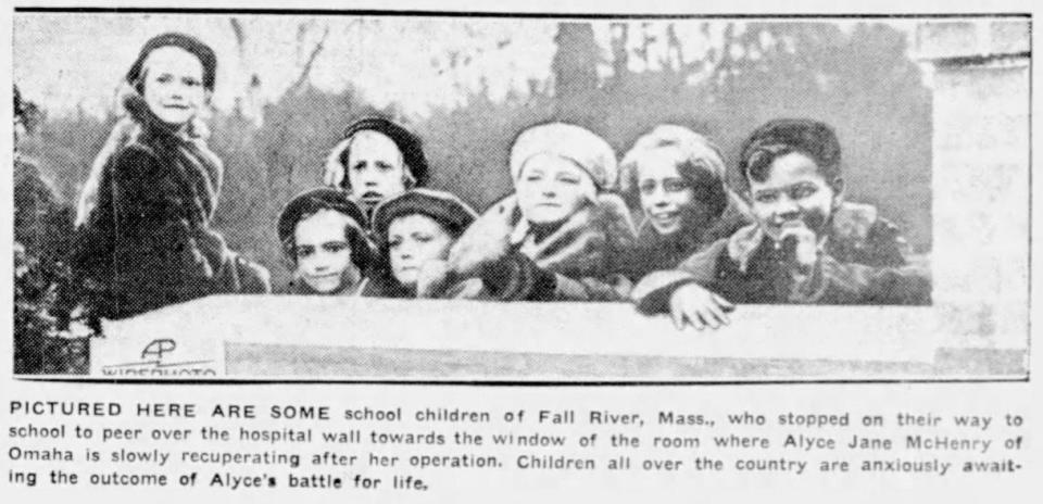 Fall River kids are photographed peering over the wall at Truesdale Hospital in 1935 to see Alyce Jane McHenry of Omaha, Nebraska. McHenry traveled to Fall River for surgery to correct an "upside-down stomach" and became a national sensation.