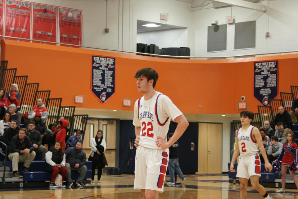 Colton Suriano waits during a foul shot in the Spartans 69-60 win over Troy in the Class A Subregionals at Liverpool High School