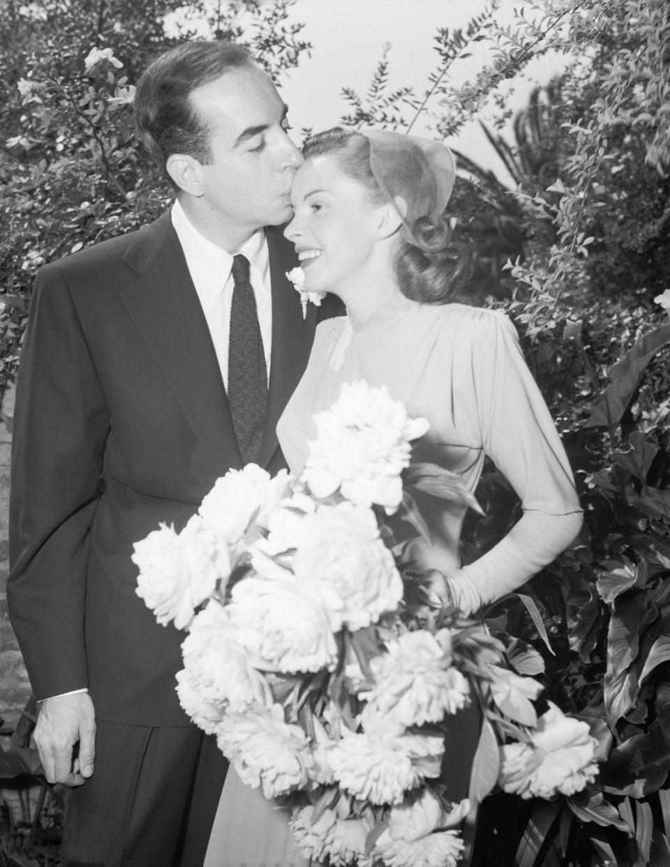 <p>Judy Garland's bouquet of white peonies nearly filled the entire camera frame as she and Vincente Minnelli said "I do" in the backyard of Garland's mother's home in Hollywood. </p><p><strong>More:</strong> <a href="https://www.townandcountrymag.com/leisure/arts-and-culture/a30284220/judy-garland-husbands/" rel="nofollow noopener" target="_blank" data-ylk="slk:Who Were Judy Garland's Five Husbands?;elm:context_link;itc:0;sec:content-canvas" class="link ">Who Were Judy Garland's Five Husbands?</a></p>