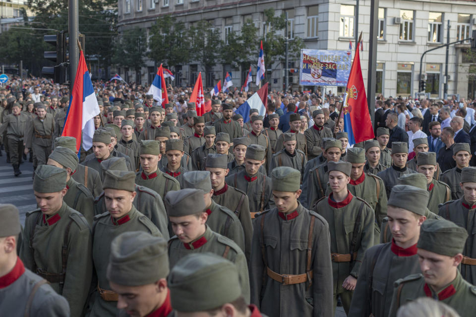 Actors dressed in Serbian WWI military uniform replicas during a ceremony to mark the newly established "Day of Serb Unity, Freedom and the National Flag" state holiday in Belgrade, Serbia, Wednesday, Sept. 15, 2021. Serbia has kicked off a new holiday celebrating national unity with a display of military power, triggering unease among its neighbors. (AP Photo/Marko Drobnjakovic)