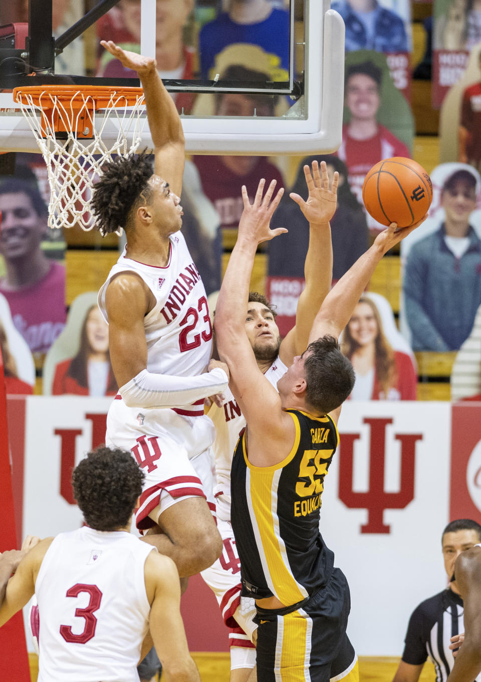 Indiana forward Trayce Jackson-Davis (23) goes up to block a shot by Iowa center Luka Garza (55) during the second half of an NCAA college basketball game, Sunday, Feb. 7, 2021, in Bloomington, Ind. (AP Photo/Doug McSchooler)