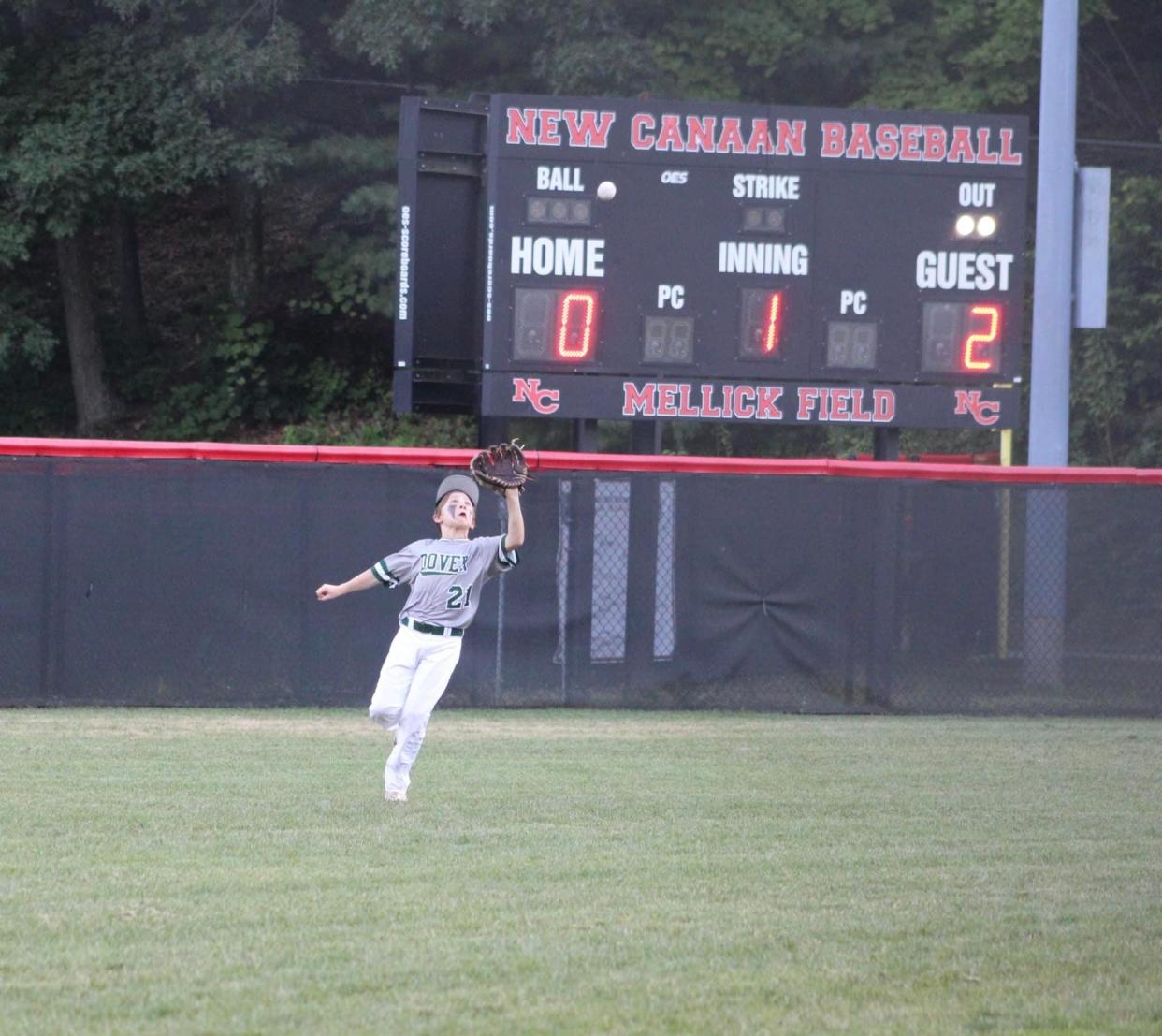 Dover 11U's Rhett Reed tracks a fly ball down to make a catch in the outfield during a 14-8 win over host New Canaan, Connecticut, Thursday, July 21, 2022, in the Cal Ripken New England regional tournament semifinals.