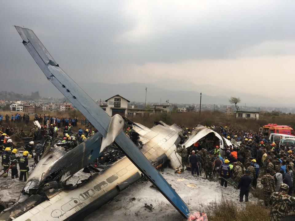 The plane crashed on Monday afternoon at Kathmandu airport in Nepal (Picture: AP)