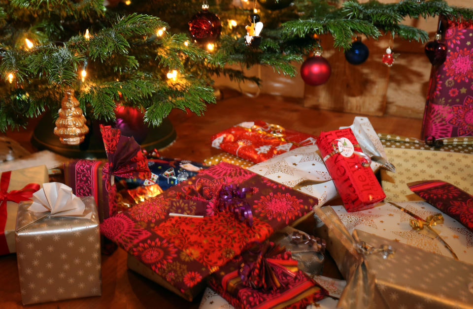 24 December 2018, Bavaria, Kaufbeuren: Packed Christmas presents lie under a Christmas tree. Photo: Karl-Josef Hildenbrand/dpa (Photo by Karl-Josef Hildenbrand/picture alliance via Getty Images)