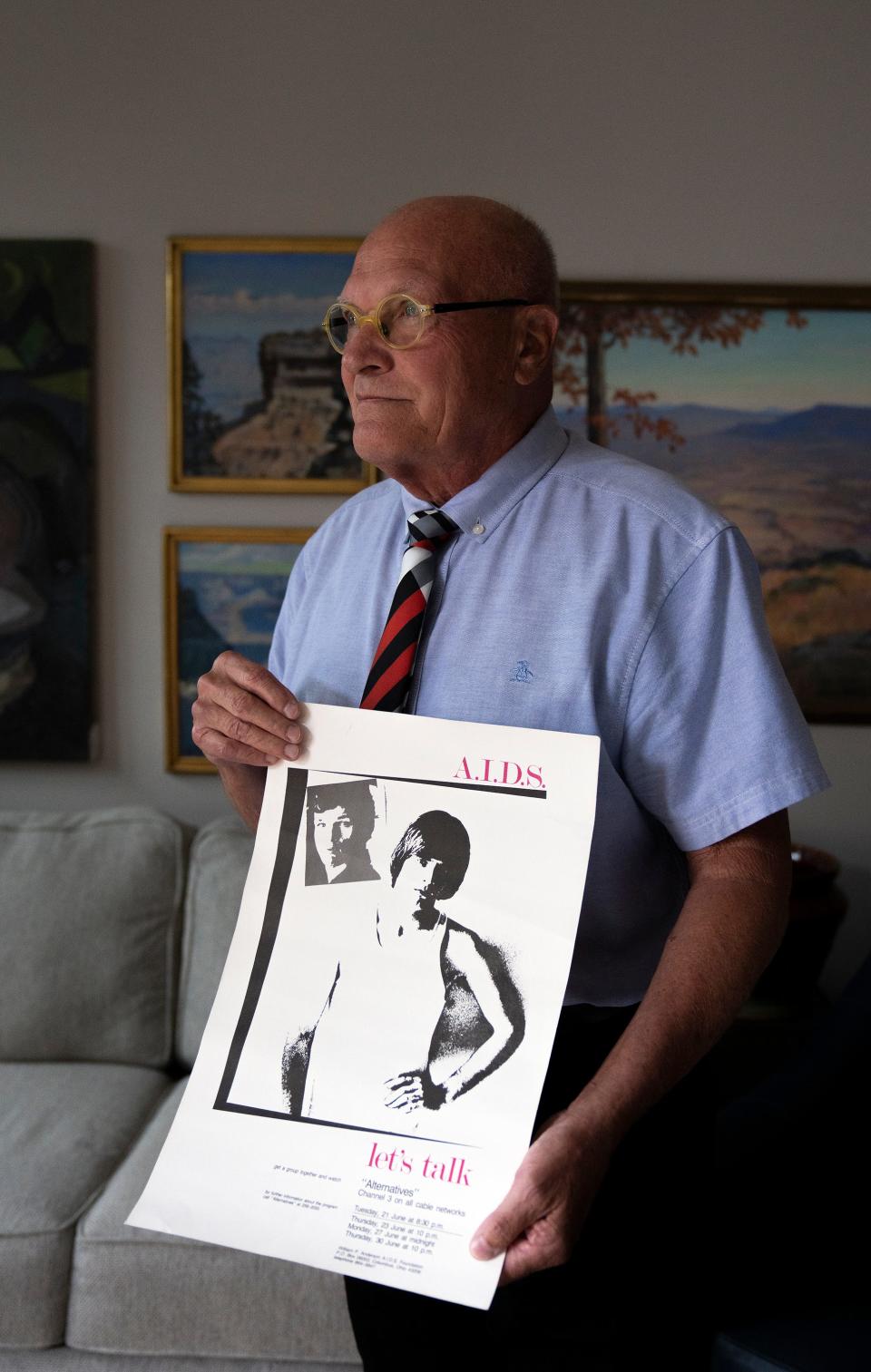 Steve Shellabarger holds a poster he created in 1988 to raise awareness about AIDS in the Columbus community. More than 40 years after the HIV/AIDS epidemic surfaced in Ohio, Shellabarger continues to be an advocate for LGBTQ rights.