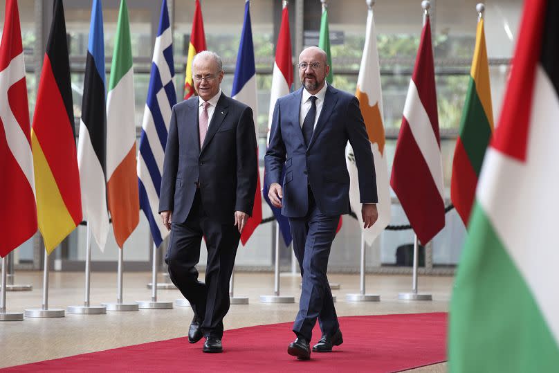 European Council President Charles Michel, right, and Prime Minister of the Palestinian Authority Mohammed Mustafa arrive at the European Council in Brussels, May 26, 2024