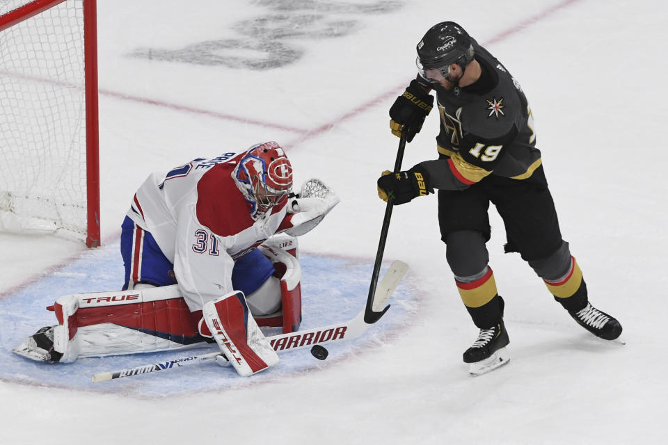 Vegas Golden Knights right wing Reilly Smith (19) shoots against Montreal Canadiens goaltender Carey Price (31) during the third period in Game 5 of an NHL hockey Stanley Cup semifinal playoff series Tuesday, June 22, 2021, in Las Vegas. (AP Photo/David Becker)