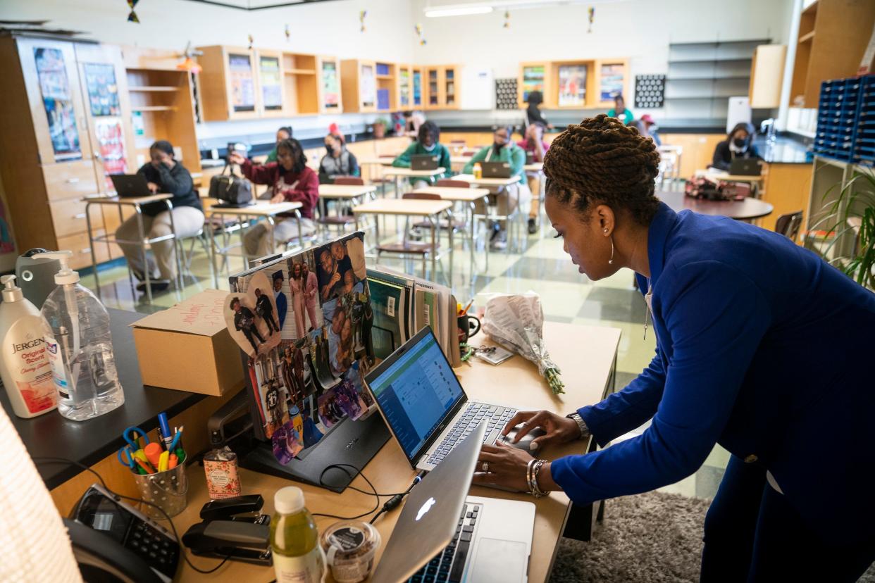 Samantha Koonce Gaines, science department chair at Thurgood Marshall Academy Public Charter High School logs in and connect a physics class taught virtually.