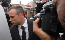 Oscar Pistorius leaves the high court in Pretoria, South Africa, Monday, April 14, 2014. Pistorius is charged with murder for the shooting death of his girlfriend, Reeva Steenkamp, on Valentines Day in 2013. (AP Photo/Themba Hadebe)