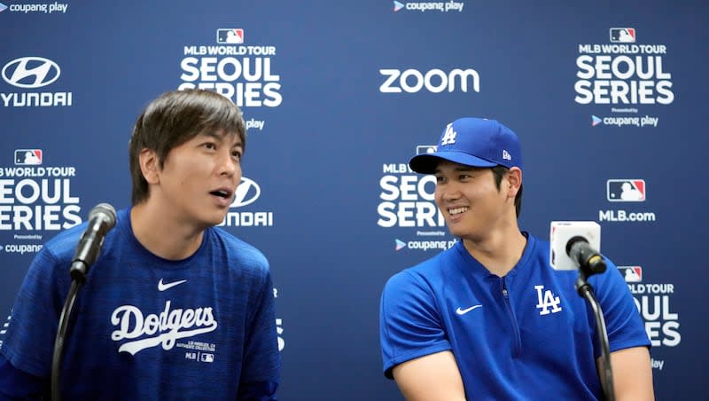 Los Angeles Dodgers' Shohei Ohtani, right, and his interpreter, Ippei Mizuhara, attend a news conference ahead of a baseball workout at Gocheok Sky Dome in Seoul, South Korea, Saturday, March 16, 2024. Ohtani’s interpreter and close friend has been fired by the Dodgers following allegations of illegal gambling and theft from the Japanese baseball star.