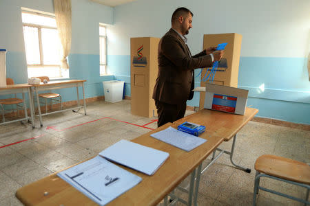 A Kurdish employee checks the room during preparations for for the September 25th independence referendum in Duhok, Iraq September 24, 2017. REUTERS/Ari Jalal