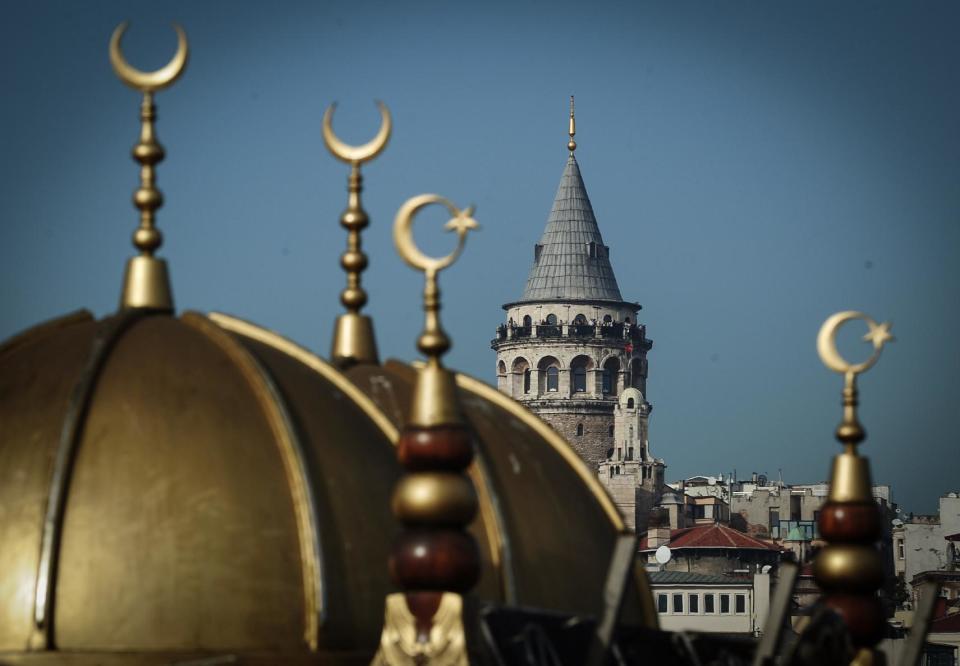 FILE - This Oct. 11, 2013 file photo shows the Galata Tower, a stone medieval observation tower, in Istanbul, Turkey. Last summer, Istanbul’s Taksim Square was the scene of violent confrontations between police and protesters. But protests have faded, and contrary to some lingering perceptions, it’s quite calm now _ except for the normal hustle and bustle found in this vibrant city. And it’s as safe for tourists as it ever was. Istanbul is a thoroughly modern place, but it traces its roots back to 660 B.C. It’s the former seat of the opulent Byzantine and Ottoman empires and is divided into European and Asian sides by the Bosporus Strait, offering a wealth of history and stunning scenery.(AP Photo/File)