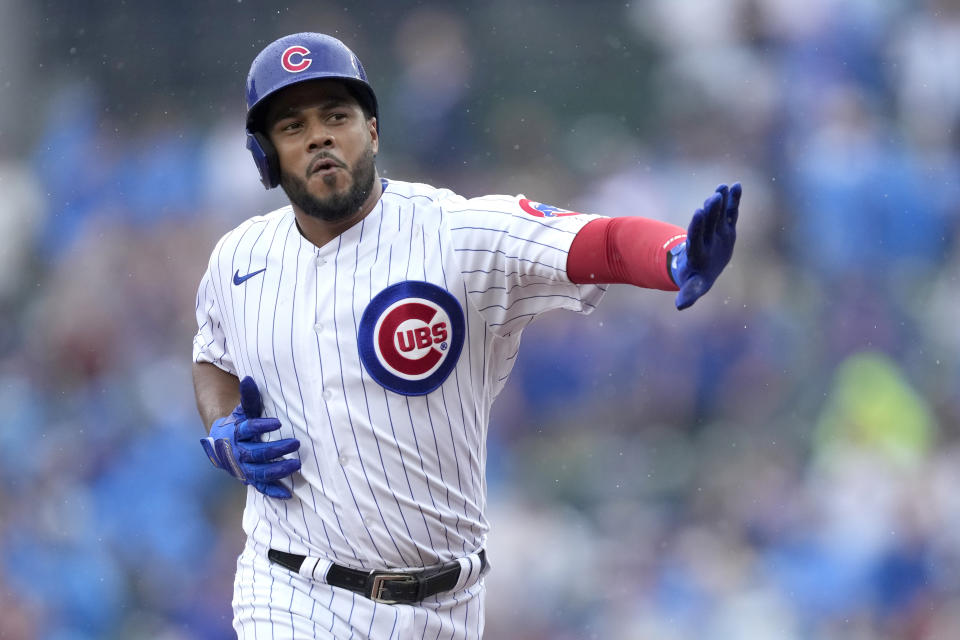 Chicago Cubs' Jeimer Candelario rounds the bases and celebrates his home run off Atlanta Braves starting pitcher Bryce Elder during the first inning of a baseball game Saturday, Aug. 5, 2023, in Chicago. (AP Photo/Charles Rex Arbogast)
