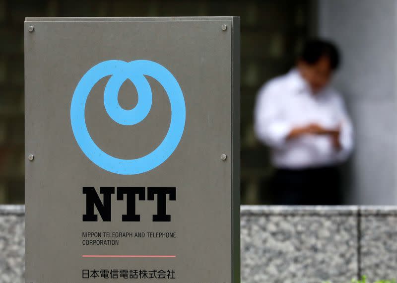 The logo of NTT (Nippon Telegraph and Telephone Corporation) is displayed at the company office in Tokyo