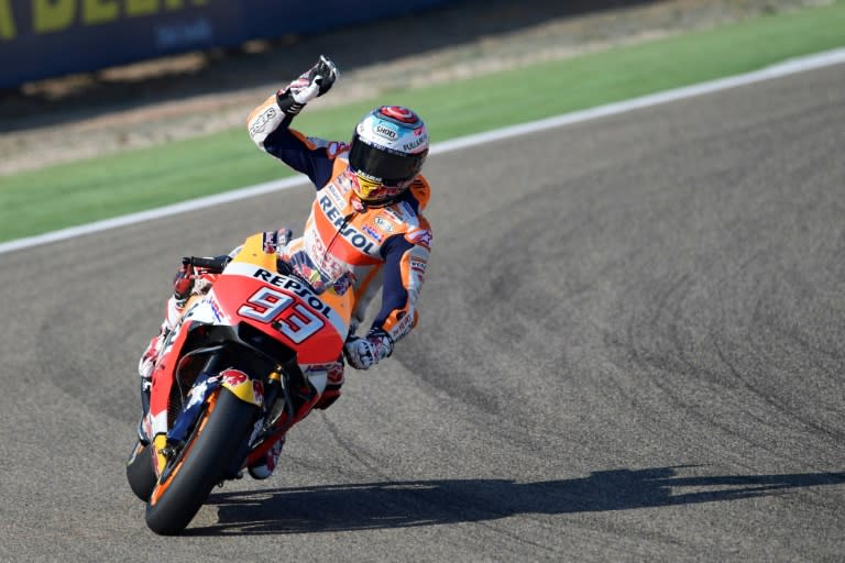 Honda's Spanish rider Marc Marquez greets fans after the third free pratice for the Moto Grand Prix of Aragon at the Motorland circuit in Alcaniz, Spain on September 23, 2017