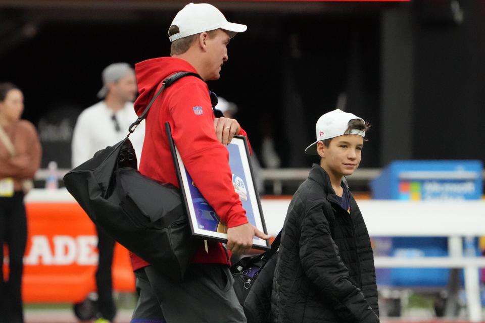 Feb 4, 2023; Paradise, NV, USA; AFC coach Peyton Manning (left) and son Marshall Manning during Pro Bowl Games practice at Allegiant Stadium.