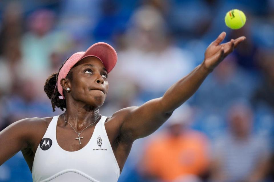 Tennis pro Sloane Stephens in action in a close up image preparing to serve with the ball in midair. 