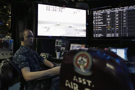 A U.S. Navy personnel works in the control room of the U.S. Navy aircraft carrier USS George Washington, during a tour of the ship in the South China Sea November 7, 2013. REUTERS/Tyrone Siu