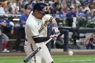 Milwaukee Brewers' Luis Urias hits a double during the fifth inning of a baseball game against the Chicago Cubs Monday, July 4, 2022, in Milwaukee. (AP Photo/Morry Gash)