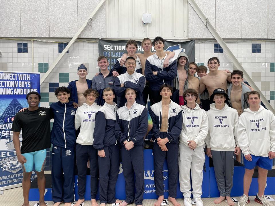 Athletes who qualified for states gathered on the podium following the Section V Class A championships Thursday, Feb. 8, 2024, at the Webster Aquatic Center.
