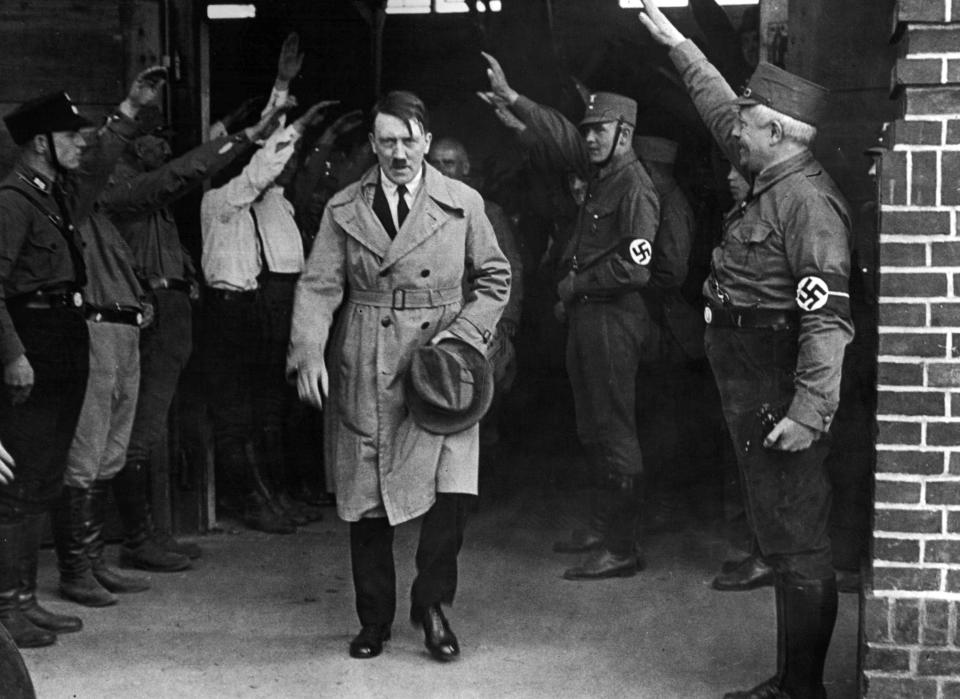 FILE - In this Dec. 5, 1931 file photo, Adolf Hitler, leader of the National Socialists, is saluted as he leaves the party's Munich headquarters. In Munich, Hitler launched his political career with speeches condemning Jews and proclaiming the ethnic superiority of Germans. (AP Photo, File)