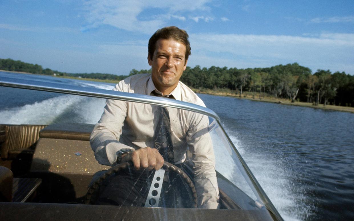 Pushing the boat out: Roger Moore during the filming of Live and Let Die in Jamaica, 1972