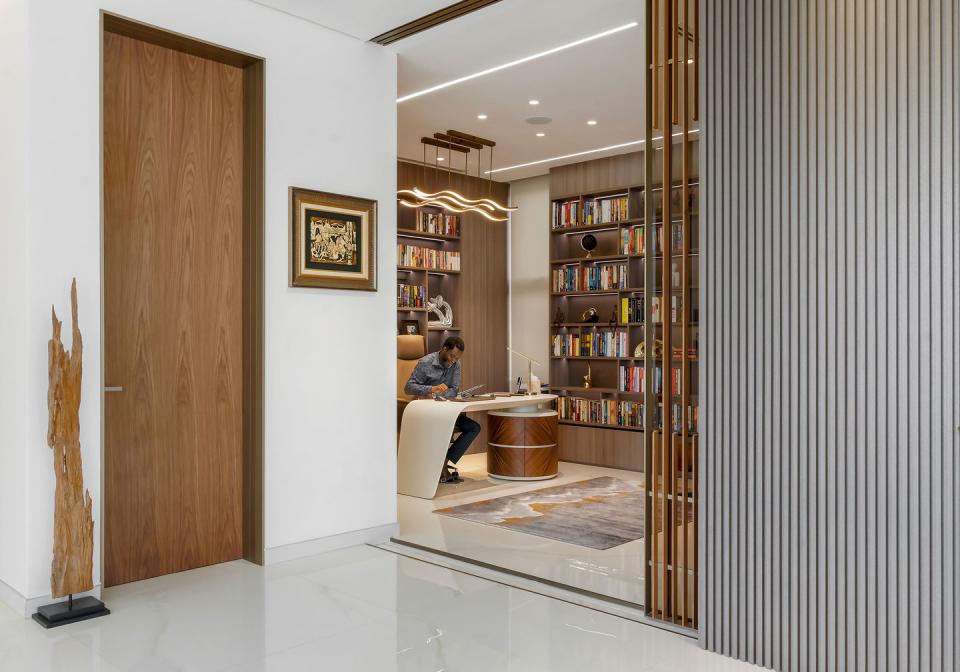 minimalist room with divider and books in the background