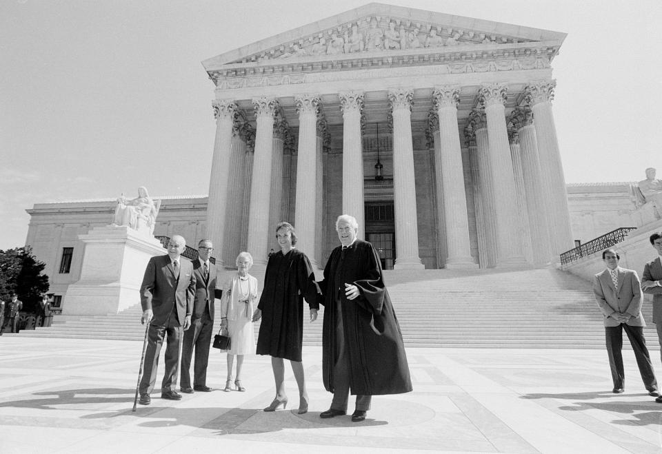 Sandra Day O'Connor poses for a photograph outside the U.S. Supreme Court in Washington, Sept. 25, 1981.  From left:  O'Connor's father Harry Day, her husband John J. O'Connor, her mother Ada Mae Day and  Justice Warren Burger.