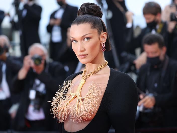 US model Bella Hadid poses as she arrives for the screening of the film &quot;Tre Piani&quot; (Three Floors) at the 74th edition of the Cannes Film Festival in Cannes, southern France, on July 11, 2021