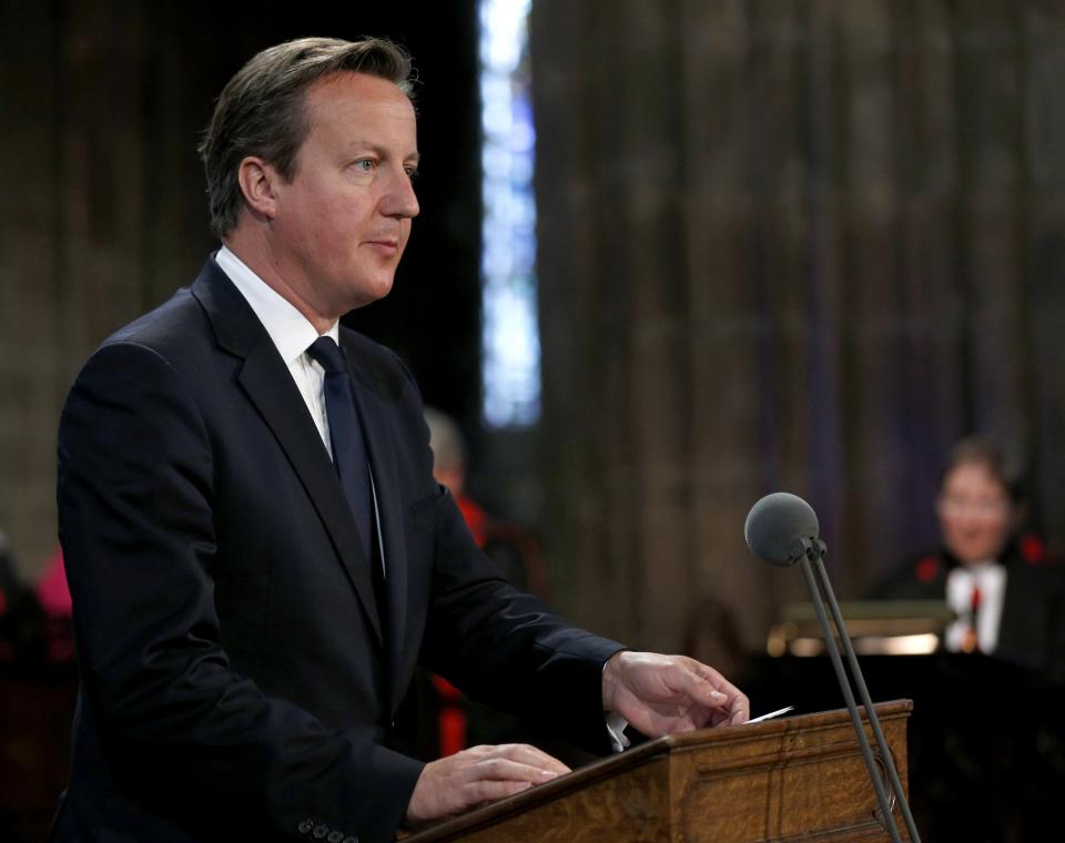 Britain's Prime Minister David Cameron reads a passage during a service for the Commonwealth to commemorate the 100th anniversary of the outbreak of World War One (WW1), in Glasgow Cathedral, in Glasgow, Scotland August 4, 2014. (REUTERS/Russell Cheyne)